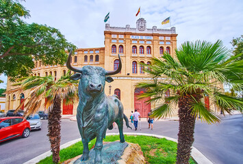 The statue of El Toro and bullring of El Puerto, Spain