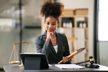 African american lawyer woman in suit holding envelope of busine