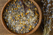 Sea himalayan salt with dry lavender and chamomile flowers , closeup, top view