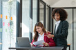 © crizzystudio - Young Asian and African businesswoman Africans brainstorming on real estate projects. investment plan Financial business together in the office management concept management.