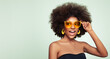 © Oleg Gekman - Beauty portrait of African American girl in colored sunglasses. Beautiful black woman. Cosmetics, makeup and fashion