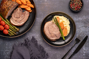 Wall Mural - Food photography of roasted lamb, carrot, asparagus, tomato, seasoning, pepper