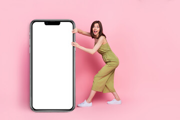 Wall Mural - Full body photo of astonished crazy lady stylish clothes hand hold mirror white panel banner empty space isolated on pink color background