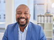 © Yusrah Abbas/peopleimages.com - Happy black man, mature or portrait in corporate office, company about us or profile picture of CEO boss. Employee smile, management or person face in financial business or success mindset