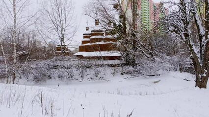 Poster - Winter scene with timber church, Mamajeva Sloboda Cossack Village, Kyiv, Ukraine