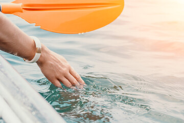 Woman hand kayak sea. Happy young woman with long hair floating in transparent kayak on the crystal clear sea. Summer holiday vacation and cheerful female people relaxing having fun on the boat