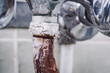 Old rusted disgusting faucet. Toned in cold colour photo of old tap covered in rust, calx. Problem of low quality of water, scarcity