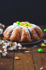 Wall Mural - Easter Cake, Traditional Cake Decorated with Sugar Eggs on Wooden Rustic Background