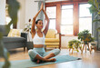 Yoga, woman and hands above head for meditation, training and exercise at home living room, wellness and holistic health. Calm biracial person meditate, prayer or praying position in pilates workout