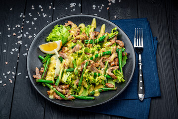 Sticker - Grilled meat salad with green beans and mustard sauce.