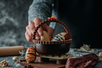 Wall Mural - man and chocolate basket as spanish mona de pascua