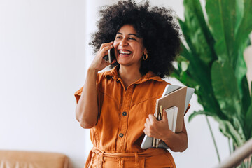 young businesswoman taking a phone call in an office