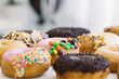 © Austockphoto - Horizontal shot of donuts with different toppings.