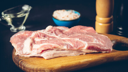 Wall Mural - meat with spices on the table before cooking