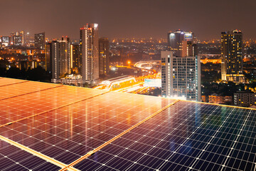 Wall Mural - solar panels on the roof of a tall building send electricity to the city life.sustainability energy 