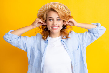 Wall Mural - Cherry earrings. Portrait of woman with cherries on yellow studio isolated background.