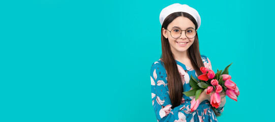 Poster - smiling child in beret with tulips. mothers or womens day. kid in glasses hold flowers. Banner of spring child girl with tulips flowers bouquet, studio portrait with copy space.