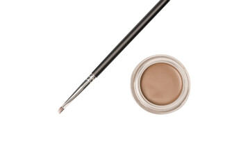 A brow pomade in blonde shade with brush isolated on a white background.