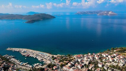 Wall Mural - Aerial view of Kaş Marina and Meis Island, revealing the picturesque coastal scenery, yachts, and unique blend of nature and architecture in Antalya, Turkey.