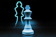 cyan blue king with led in the shape of king. close up photo with black background. chess piece illustration, horizontal photo
