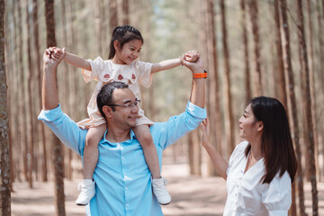 Wall Mural - Happy family in the nature travel. family on weekend playing together in the forest.