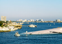 Destin On The Gulf Coast Of Florida, USA. Fishing Boat Entering The Harbour Of The Popular Fishing Resort Of Destin