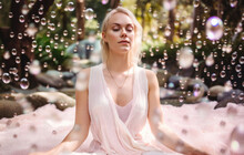 Woman Meditating In A Garden Surrounded By Pink Bubbles. Generative AI. 