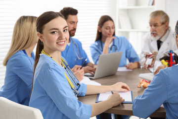 Portrait of young intern wearing uniform on lecture in university