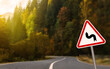© New Africa - Series Of Curves road sign on highway, space for text