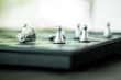 © Dontree - A group of silver pawn chess piece winners. The concept of board games, logic, training for the brain, teamwork to victory, business strategy concept and leader and teamwork concept for success.