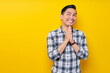 © Bangun Stock Photo - Handsome young Asian man trustfully pleaded in plaid shirt while hands folded in a prayer gesture, begging about something isolated on yellow background. people lifestyle concept