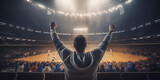Fototapeta Sport - basketball fan in the stands of a basketball stadium raising his arms cheering for his team