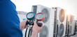 © Nonthanat - Technician is checking air conditioner,measuring equipment for filling air conditioners.
