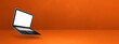 © daboost - Floating computer laptop isolated on orange. Horizontal banner background