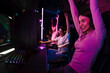 © Drobot Dean - Team of gamers celebrating victory while playing online video game on tournament in cybersport club