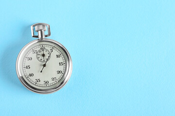 Wall Mural - Vintage timer on light blue background, top view with space for text. Measuring tool