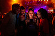 © bernardbodo - Friends using mobile phone at concert