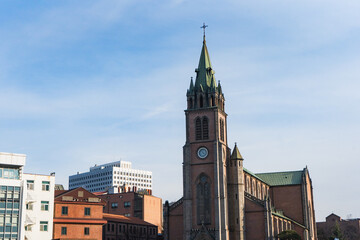 Myeongdong Catholic Cathedral locate at Myeongdong shopping street during winter sunny day at Jung-gu , Seoul South Korea : 2 February 2023