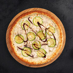 Wall Mural - Freshly baked chicken pizza with zucchini and balsamic sauce