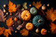 Pumpkins and fall leaves on table