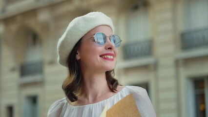 Wall Mural - Attractive woman in sunglasses with Eiffel Tower reflection