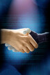 Handshake of a human hand and plastic robot arm, artificial intelligence AI concept. Internet, programming, abstract background