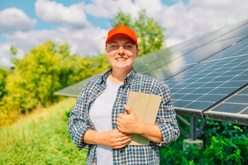 Farmer is using smart tablet to do research about photovoltaic solar panel at garden. Green technology agriculture. Renewable energy, Natural power. Eco-friendly lifestyle. 