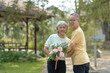 © amnaj - Elderly couple. Asian couple giving love to each other smiling happily.