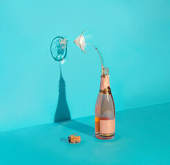 Wall Mural - Concept art with Champagne bottle and glass. Minimal art direction with a party or celebration theme.