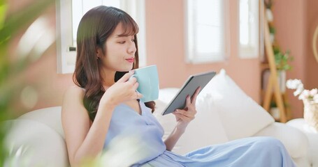 Sticker - asian woman watching tablet easily