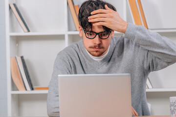 Canvas Print - surprised student looking at computer or laptop