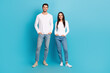 © deagreez - Full size photo of two positive people put hands pockets have good mood isolated on blue color background