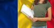 Half-length portrait of a female student with a folder. Foreign language teaching concept.