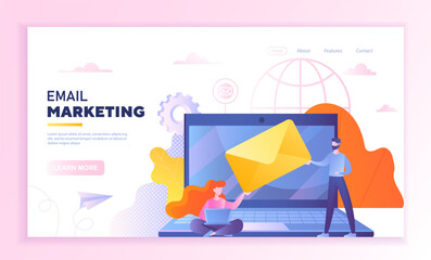 Wall Mural - email marketing concept. man and woman stand with envelope next to laptop. communication on internet